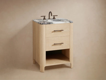 Partially open Calista Powder Vanity drawer, light oak finish, bronze handle. White towel, wooden box, and bottles inside.
