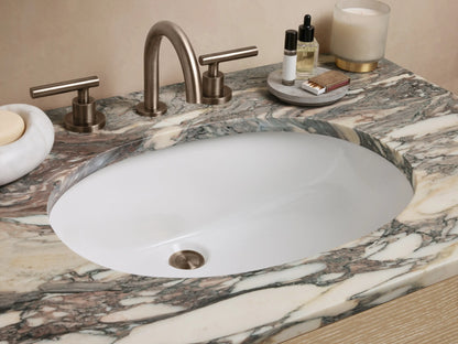 Calista Single Vanity, light oak wood with two drawers, dark pulls, an open shelf, and a swirling marble top.