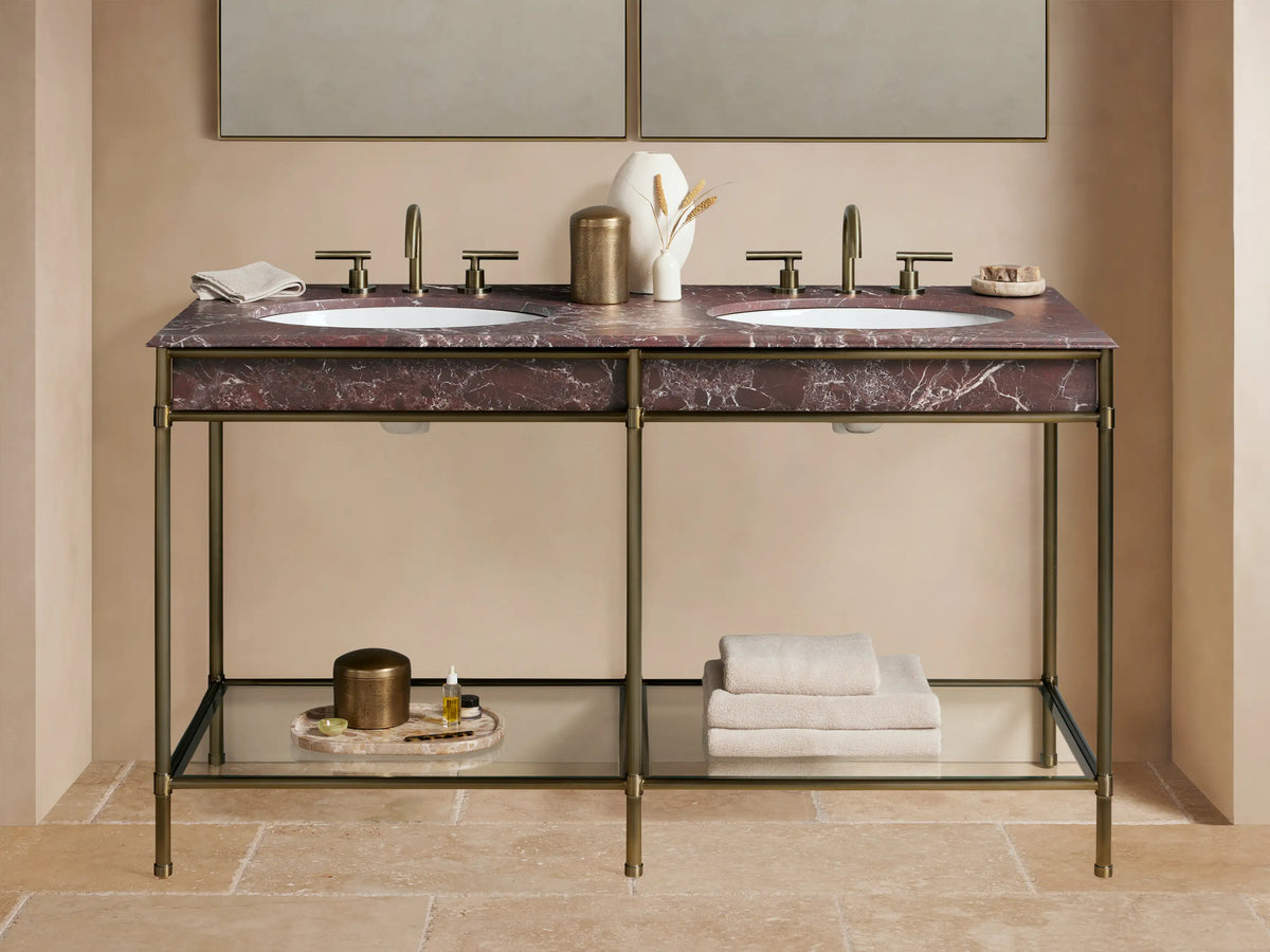 Chelsea Double Washstand: Antique brass frame, Red Levanto marble top with two white sinks, brass faucets, and lower glass shelf.