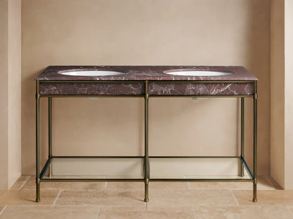 Chelsea Double Washstand: Antique brass frame, Red Levanto marble top with two white sinks, brass faucets, and lower glass shelf.