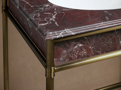 Chelsea Double Washstand: close-up of a white oval ceramic undermount sink in Red Levanto marble, with three faucet holes.