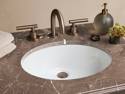 Chelsea Powder Washstand: dark antique bronze frame, dark marbled stone top with white oval sink, and a glass shelf.