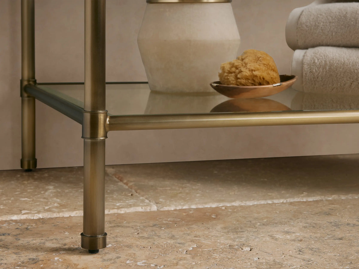 Angled close-up of Chelsea Single Washstand with white marble top featuring grey veins and antique brass frame.