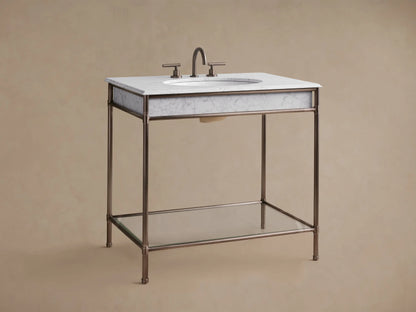 Chelsea Single Washstand: close-up of white marble top with grey veins, dark bronze metal frame & leg, and white sink.