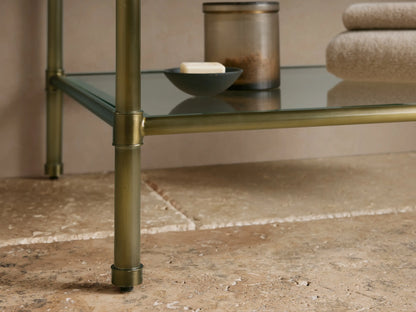 Close-up of Chelsea Single Washstand's corner: dark Red Levanto marble top with white veins, antique brass frame.