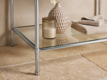 Close-up of Chelsea Single Washstand with dark brown, white-veined marble top, polished nickel frame, and white ceramic sink edge.