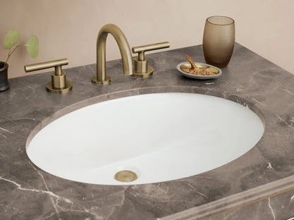 Chelsea Single Washstand with dark gray veined marble top, white oval sink, antique brass frame, and glass shelf.