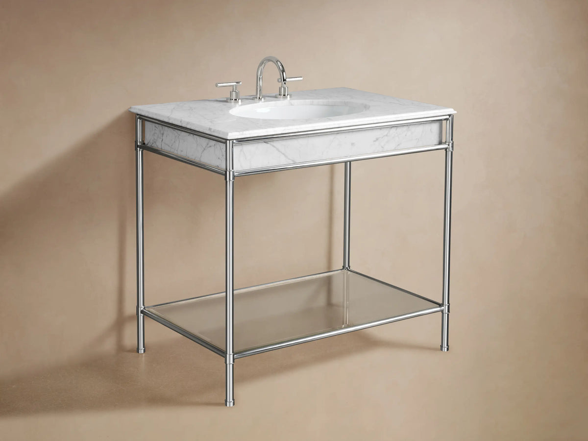 Chelsea Single Washstand close-up: white marble top, polished nickel frame. Glass shelf holds folded white towels & a tray.