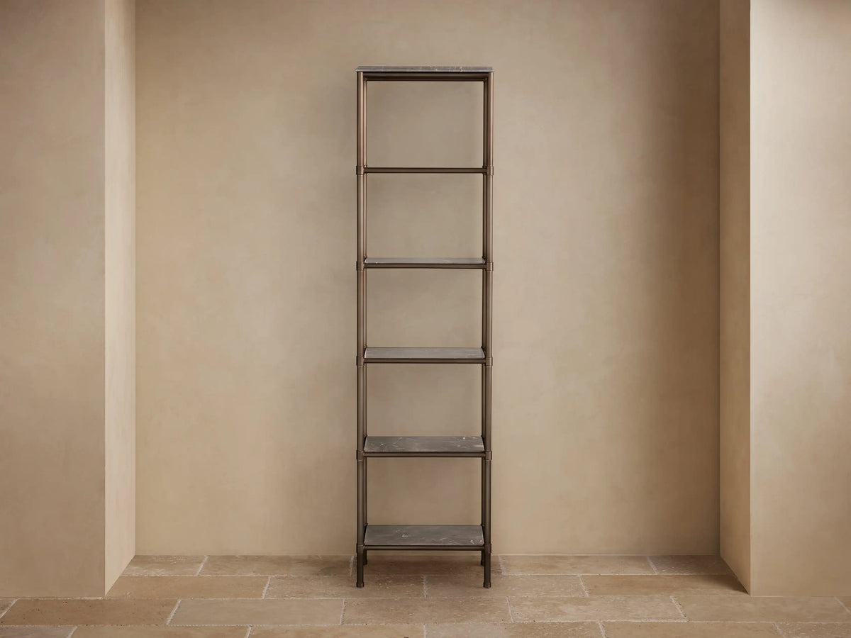 Close-up of Chelsea Tall Etagere's honed brown marble top with white veins and bronze-finished metal frame.