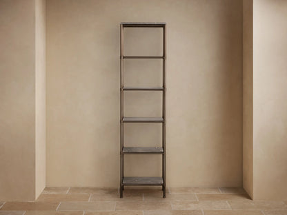 Close-up of Chelsea Tall Etagere's honed brown marble top with white veins and bronze-finished metal frame.