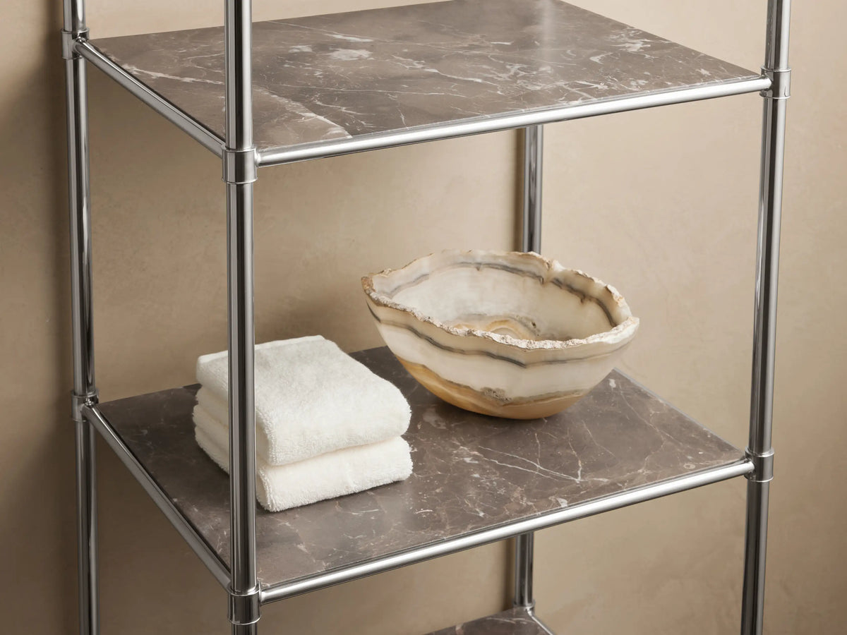 Chelsea Tall Etagere with polished nickel finish, featuring five open shelves. The frame is sleek and minimalist. One stone top visible.