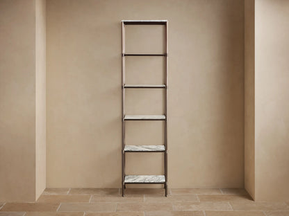 Angled close-up of Chelsea Tall Etagere. White Carrara marble top with grey veins, supported by an antique bronze frame.