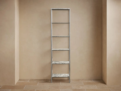 Chelsea Tall Etagere close-up: white Carrara marble top with gray veins, decorative edge, and polished nickel frame.