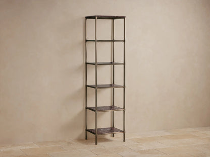 Close-up of Chelsea Tall Etagere's Brown Espresso marble top with detailed edge and antique brass-finished metal frame.
