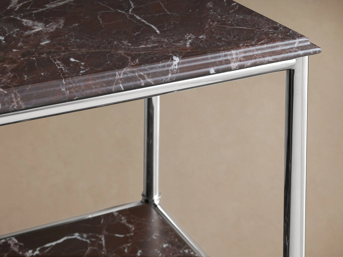 Chelsea Tall Etagere: polished nickel frame, Red Levanto marble shelves with a vase, plant, and cosmetic bottles.
