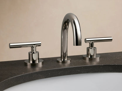 Crewe Smooth Faucet with polished nickel finish, curved spout, and dual handles on a white marble countertop with an oval sink.