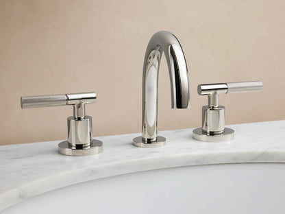 Crewe Knurled Faucet in polished nickel, featuring a curved spout and two cylindrical handles on a marble countertop.
