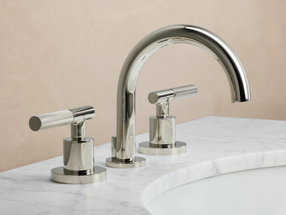 Crewe Knurled Faucet in polished nickel, featuring a curved spout and two cylindrical handles on a marble countertop.