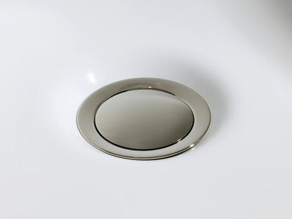 Crewe Knurled Faucet in polished nickel finish, featuring a cylindrical base and a textured knurled handle on a marble surface.