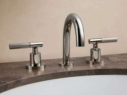 Crewe Knurled Faucet in polished nickel finish; features curved spout and two textured handles on a marble countertop.
