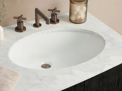 Danny Double Vanity. Dark espresso wood with curved edges, white marble top, two sinks, central drawers, side cabinets, brass hardware.