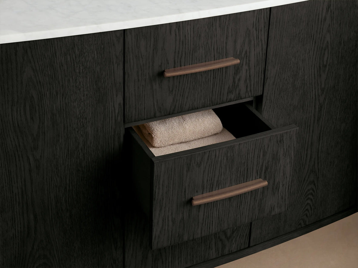 Danny Double Vanity's dark wood cabinet door open, showing beige towels on a shelf & wooden blocks on another, with visible wood grain.