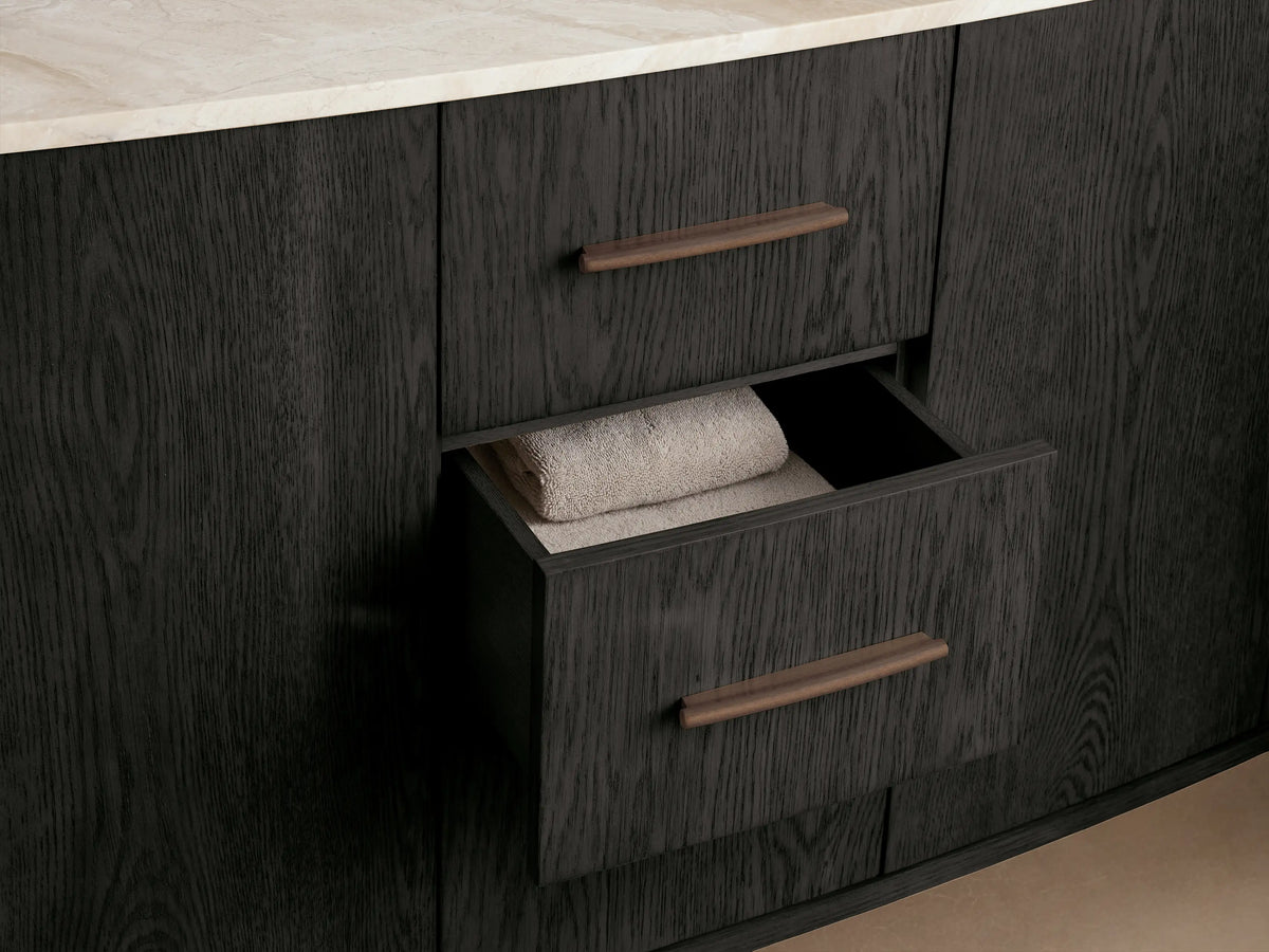 Danny Double Vanity, open dark oak cabinet with visible wood grain, showing interior shelves, folded light towels, and decor.