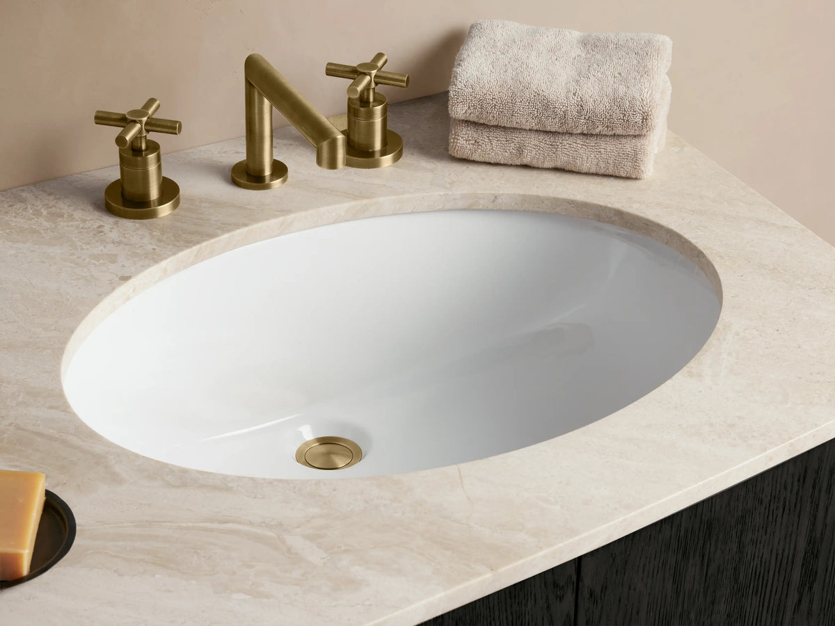 Dark wood curved Danny Double Vanity with white marble top, two sinks, 3 drawers, 4 doors & brass hardware.