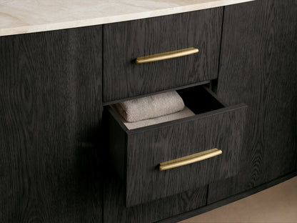 Danny Double Vanity: White oval sink in light veined marble top, modern brass widespread faucet, soap, and stacked towels.
