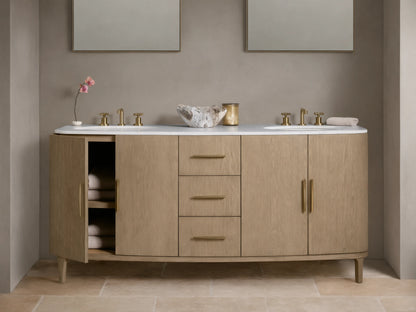 Danny Double Vanity made of oak wood with brass hardware, two sinks, and a marble top. Features multiple drawers and open shelves.