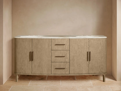 Danny Double Vanity: light wood with visible grain, white marble top, dual sinks, dark faucets. Left cabinet open showing towels, 3 drawers, 2 doors.