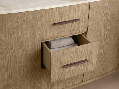 Danny Double Vanity's light oak cabinet, door partially open. Interior shows shelves, folded towels, and a decorative box.