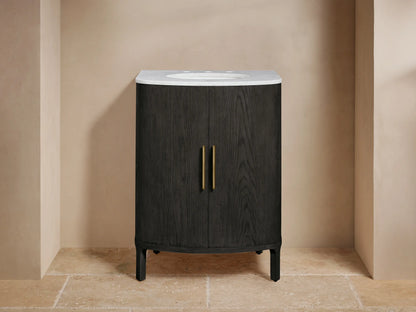 Close-up of Danny Powder Vanity's open black oak door, showing wood grain, brass handle, curved shelves, and folded towels.