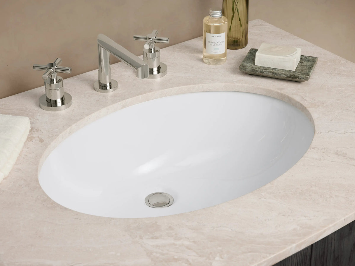Danny Single Vanity with dark oak wood finish, marble top, and dual metal handles, set against a neutral-toned wall.