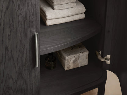 Danny Single Vanity with an oval ceramic undermount sink in a marble countertop, silver faucet, soap and lotion displayed.