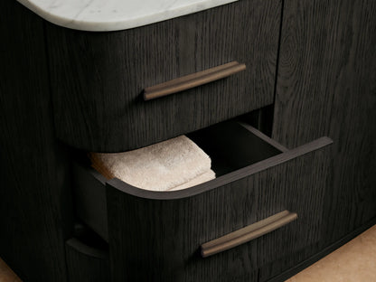 Danny Wide Single Vanity: White oval undermount sink, antique bronze faucet, Carrara marble top, black marble accessories.