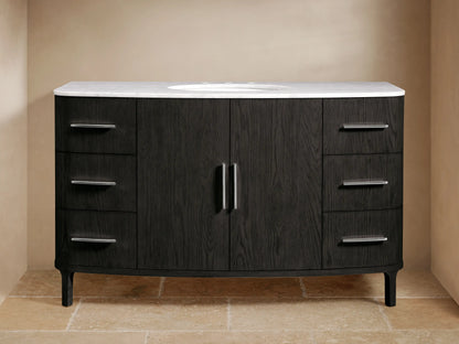 Danny Wide Single Vanity: Dark oak wood with prominent grain, white Carrara marble top, oval sink, polished nickel handles.