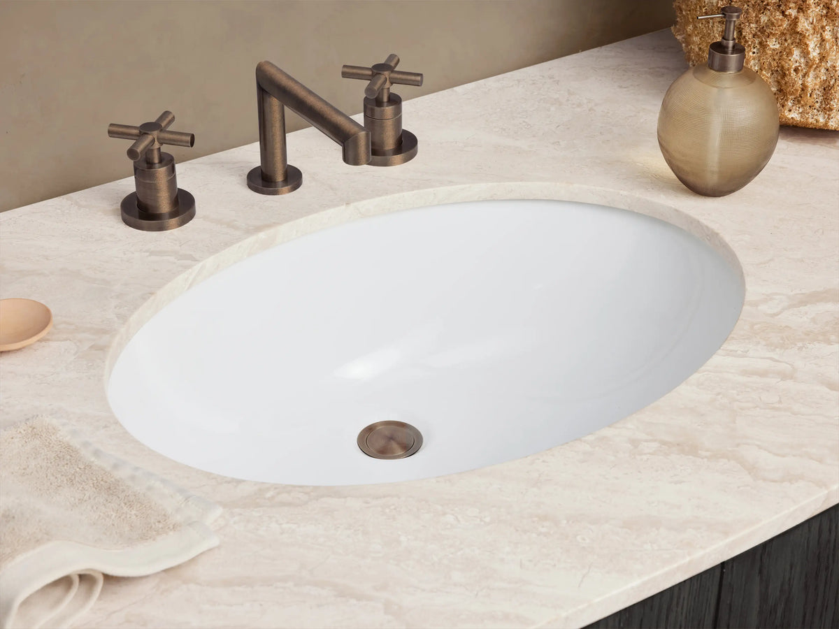 Danny Wide Single Vanity, dark grey oak finish, curved front, white marble top, oval sink, bronze bar pulls on drawers & doors.