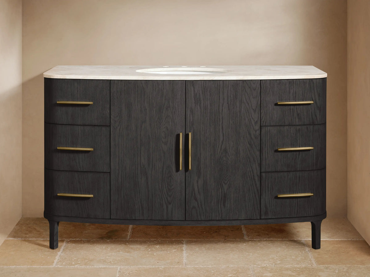 Danny Single Wide Vanity made of dark oak wood with two central doors and three drawers on each side, gold hardware, and white stone top.