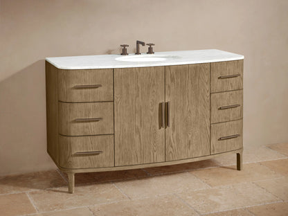 Close-up of Danny Wide Single Vanity's light oak cabinet, partially open, revealing white towels and dark bronze handles.