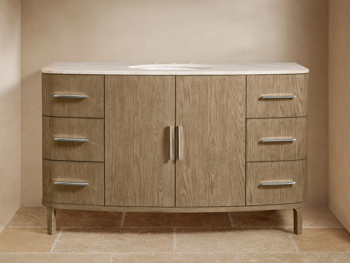 Danny Single Wide Vanity with oak wood finish, marble top, oval sink, polished nickel handles, and soft-close drawers on tiled floor.