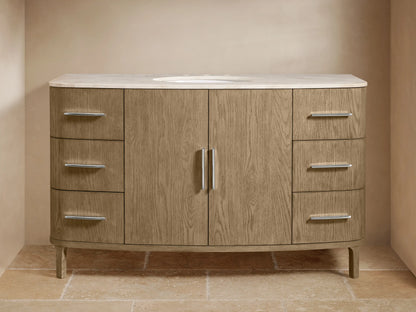 Danny Single Wide Vanity with oak wood finish, marble top, oval sink, polished nickel handles, and soft-close drawers on tiled floor.