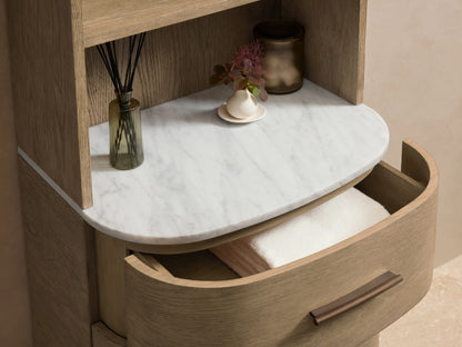 Light oak Danny Bath Cabinet with arched top, 4 open shelves, white marble, and 3 drawers with dark pulls.