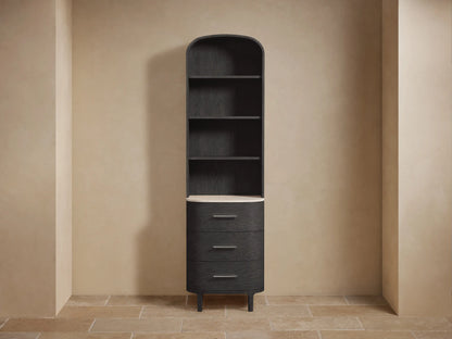 Danny Bath Cabinet: Tall, dark wood with arched top, open shelves, light stone counter, and three curved drawers with silver pulls.