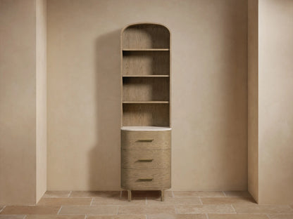 Danny Etagere with oak wood shelves, a Carrara marble top, small vase, and a stack of towels on the shelf.