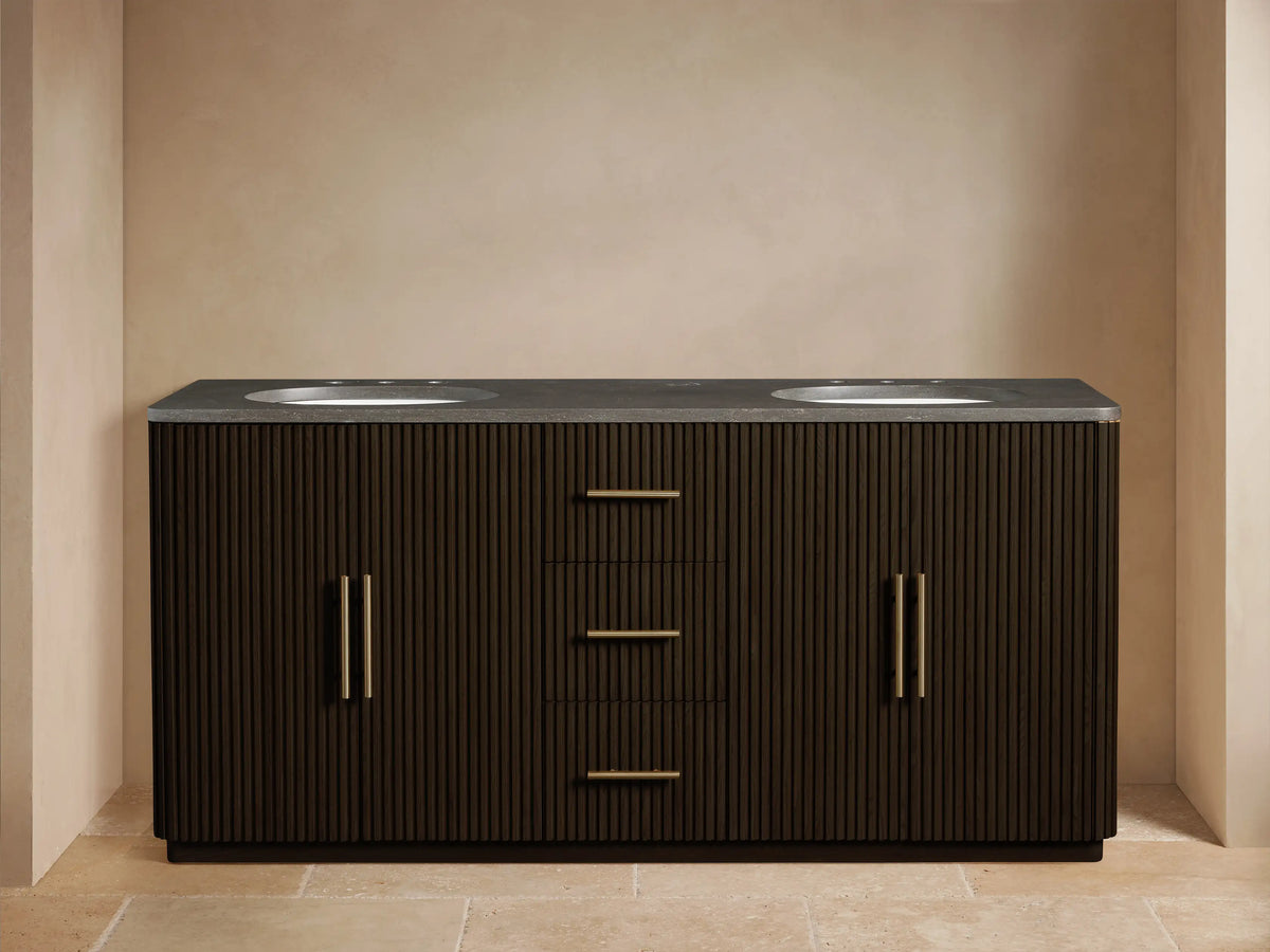 Open dark reeded wood Finnley Double Vanity cabinet with golden pull. Inside, a sponge in a white bowl and stacked white towels.
