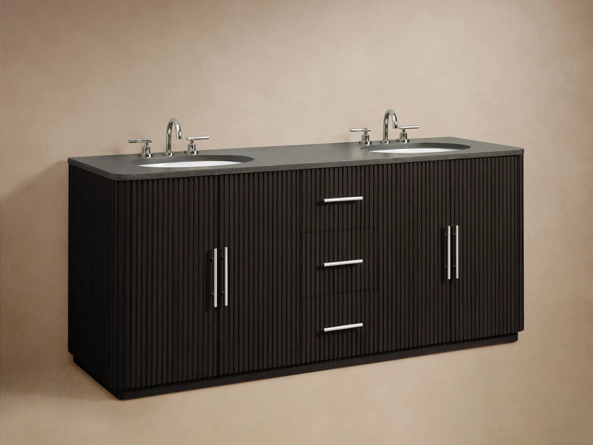 Finnley Double Vanity, dark fluted door partially open with polished handle, showing folded white towels on a shelf, toiletries on a tray.