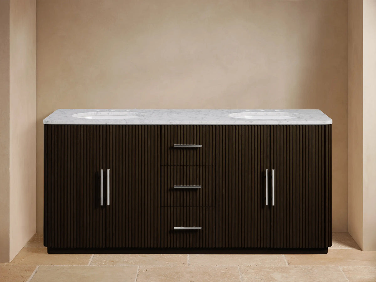 Finnley Double Vanity, dark brown reeded wood, white marble top, 2 oval sinks, chrome faucets. Left door open, center drawers.