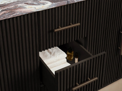 Open Finnley Double Vanity dark oak cabinet door with fluted texture, bronze handle, revealing interior shelf, white towels, and bowl.