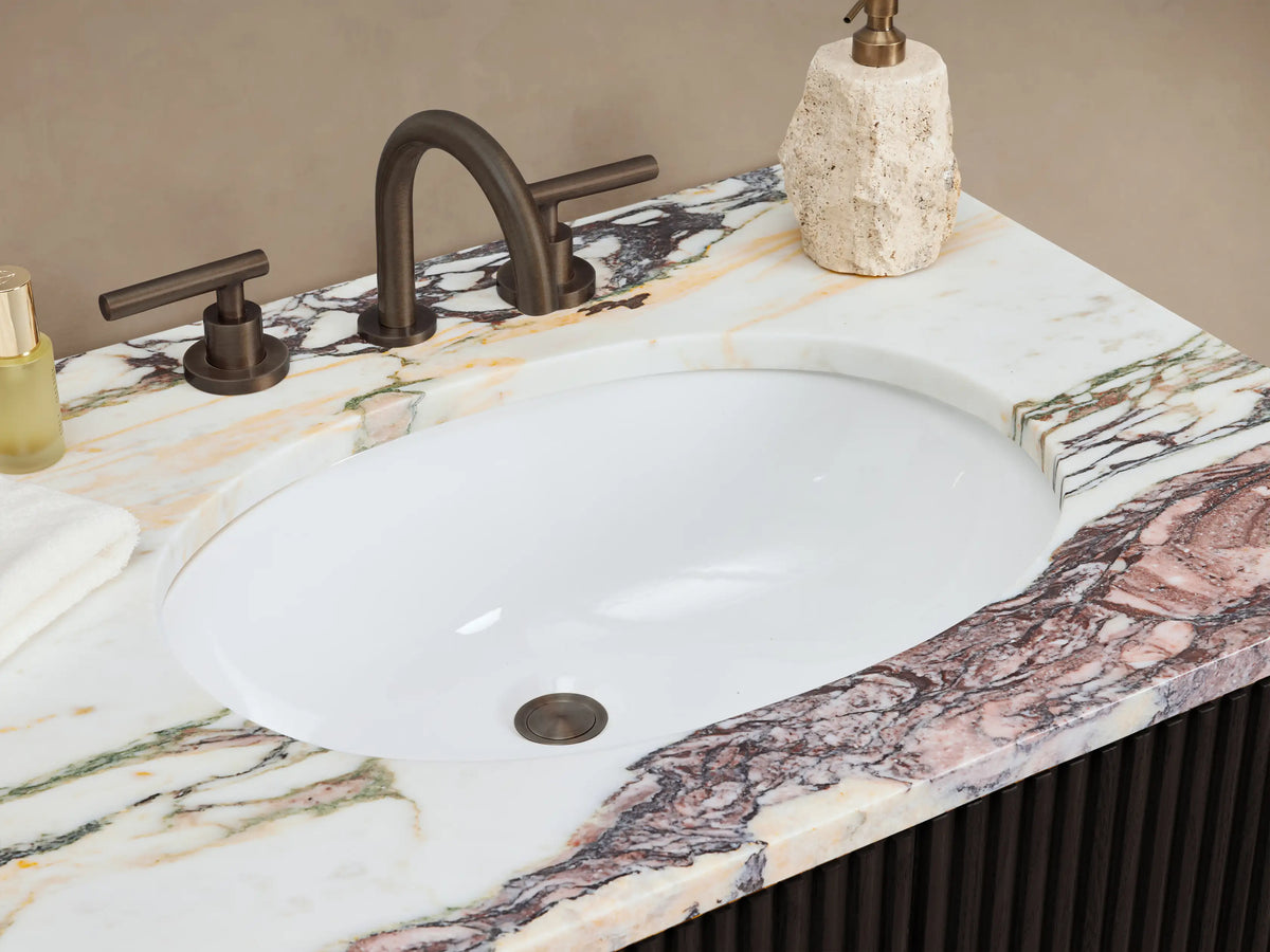 Dark ribbed Finnley Double Vanity with reddish-brown marble top, one drawer open revealing white towels and bottles.
